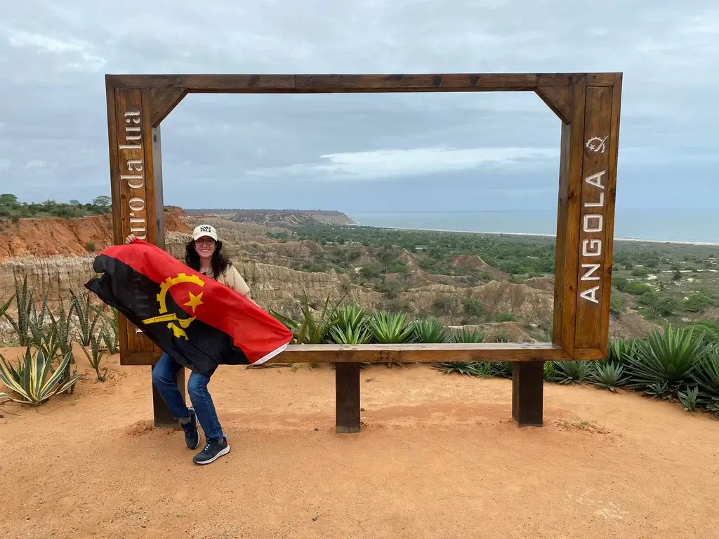 me with an Angolan flag at Miradouro da Lua